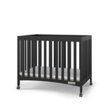 Child Craft London Mini Compact Folding Portable Crib with 2” Crib Mattress and 2 Easy Roll Locking Wheels, Durable Pine Wood Construction (Ebony Black)