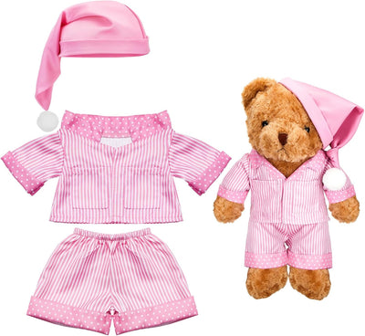 Set of pink pajamas with matching hat and shorts for a teddy bear on a white background