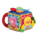Colorful children's toy cube with animal faces and sounds on a white background