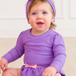 RuffleButts Baby Girls UPF50+ Princess Long Sleeve Bow Skirted One Piece Swimsuit - Amethyst Princess, 18-24m