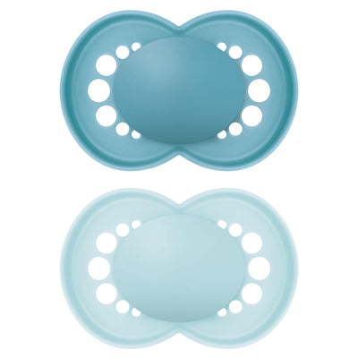 Two blue silicone pacifiers on a white background