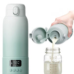 Mint green thermos with digital display pouring milk into a glass jar on a white background