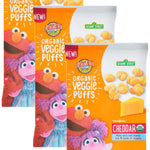 Four packages of Organic Veggie Puffs with Sesame Street characters on a white background