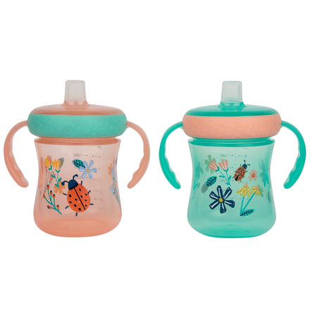 Two children's sippy cups with floral and insect designs on a white background