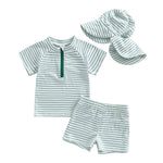 Children's swim set with striped rash guard, shorts, and hat on a white background