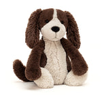 Stuffed dog toy with brown and beige fur on a white background