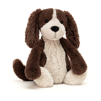 Stuffed dog toy with brown and beige fur on a white background