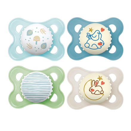 Four colorful baby pacifiers with cartoon designs on a white background