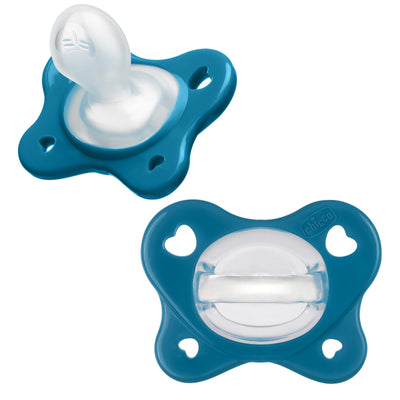 Two blue baby pacifiers on a white background