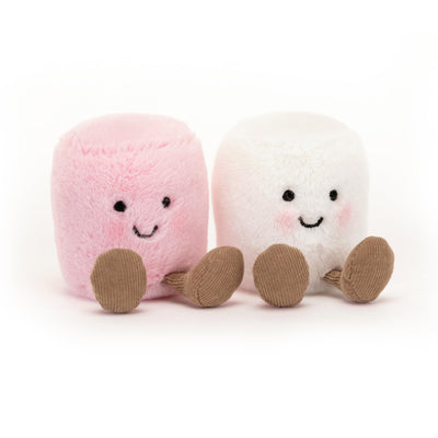 Two plush marshmallow toys, one pink and one white, on a white background