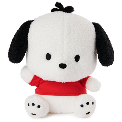 Plush toy resembling a dog with a red shirt on a white background