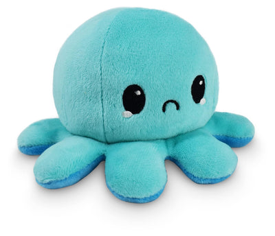 Blue plush octopus toy on a white background