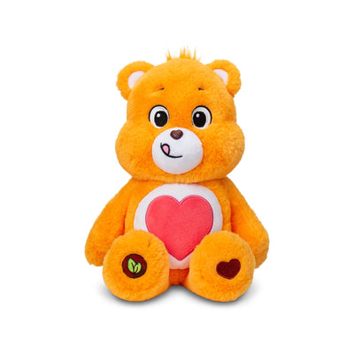 Orange teddy bear with a pink heart on a white background