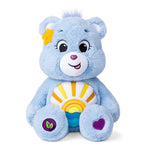 Blue teddy bear with a rainbow design on a white background