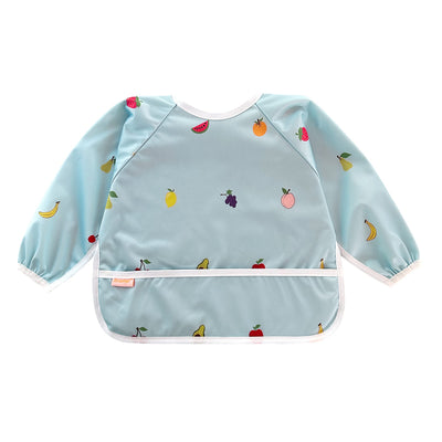 Light blue children's apron with fruit patterns on a white background