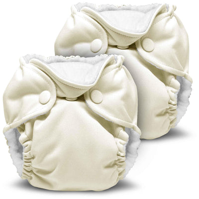 Two cream-colored cloth diapers on a white background