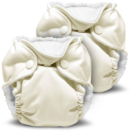 Two cream-colored cloth diapers on a white background