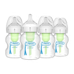 Four Dr. Brown's baby bottles with green nipples on a white background