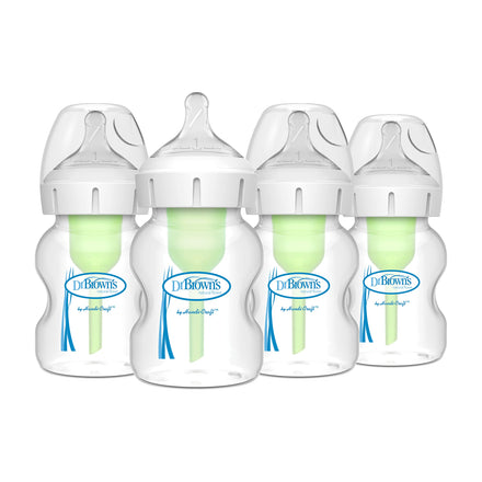 Four Dr. Brown's baby bottles with green nipples on a white background
