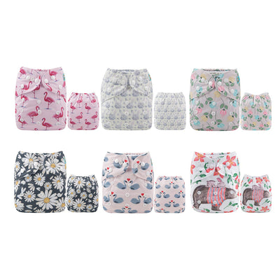 Set of patterned cloth diapers on a white background
