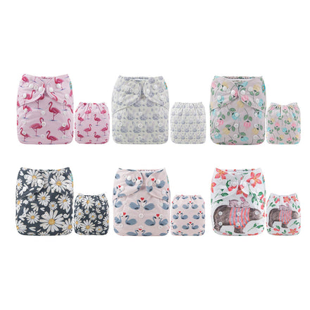 Set of patterned cloth diapers on a white background
