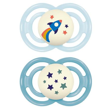 Two baby pacifiers with space-themed designs on a white background