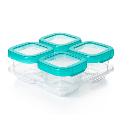 Four clear food storage containers with teal lids on a white background