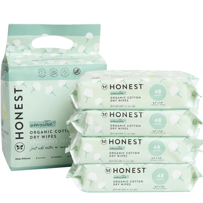 Packaging of the Honest Company organic cotton dry wipes with a stack of wipes in front.