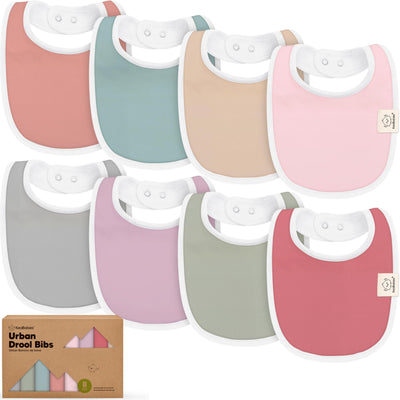 Set of colorful baby bibs with a cardboard box labeled 'Urban Drool Bibs' on a white background.