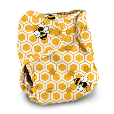 Yellow and white diaper with honeycomb pattern and bee illustrations on a white background