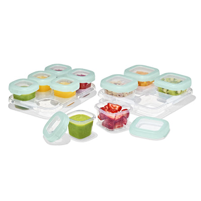 Set of baby food storage containers with lids on a white background