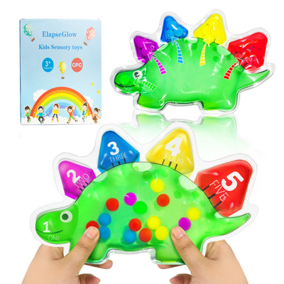 Colorful dinosaur-shaped sensory toy with numbers and letters, held by a child's hands.