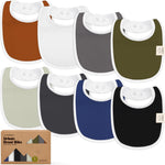 Collection of colorful baby bibs with a branded box in the foreground.