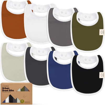 Collection of colorful baby bibs with a branded box in the foreground.
