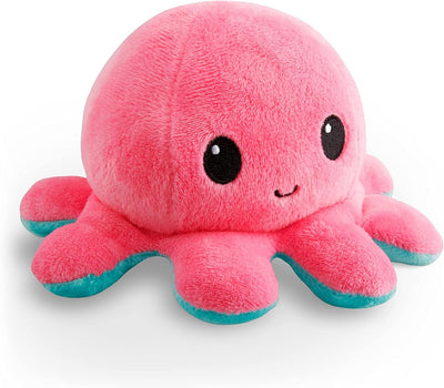 Pink plush octopus toy with black eyes on a white background