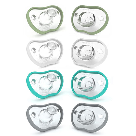Set of baby pacifiers with green, gray, and teal borders on a white background
