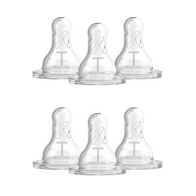 Set of six clear baby bottle nipples with 'TT' marking on a white background