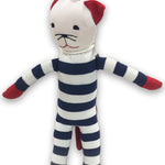 Stuffed toy cat in a striped outfit with red paws and ears on a white background
