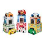Set of colorful toy buildings with vehicles on a white background