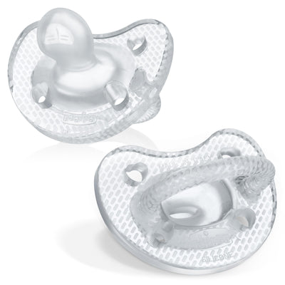 Two white baby pacifiers on a white background