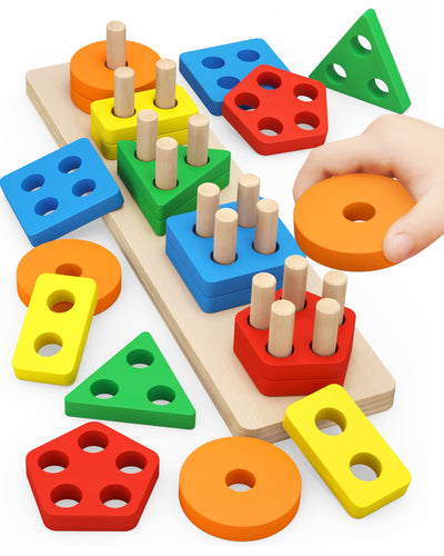 Colorful geometric shape sorting toy with wooden pegs and a hand placing an orange shape on top.