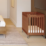 Foundations Boutique Folding Mini Baby Crib, Compact, Portable, Wooden Hotel Crib, Foldable Mini Crib for Baby & Toddlers, Includes 3" Foam Mattress, Cherry