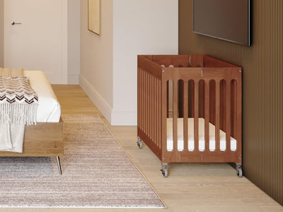 Foundations Boutique Folding Mini Baby Crib, Compact, Portable, Wooden Hotel Crib, Foldable Mini Crib for Baby & Toddlers, Includes 3" Foam Mattress, Cherry