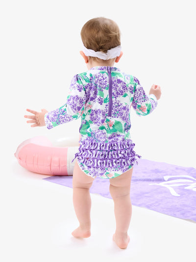 RuffleButts Baby Girls UPF 50+ Sun Protection Floral Printed Long Sleeve One Piece Rash Guard Swimsuit with Zipper - Purple Hydrangea Garden, 3-6m