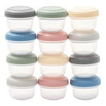 Set of small containers with colorful lids on a white background