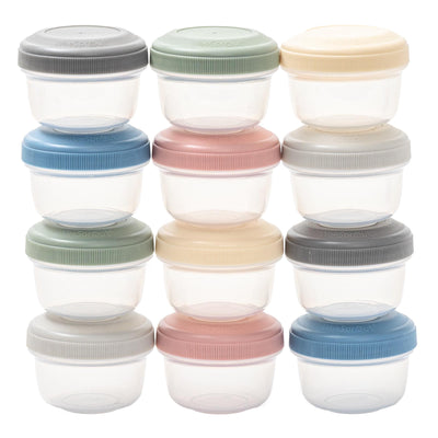 Set of small containers with colorful lids on a white background