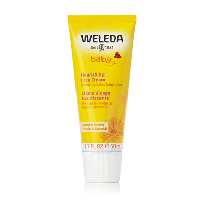 Weleda baby nourishing face cream tube on a white background