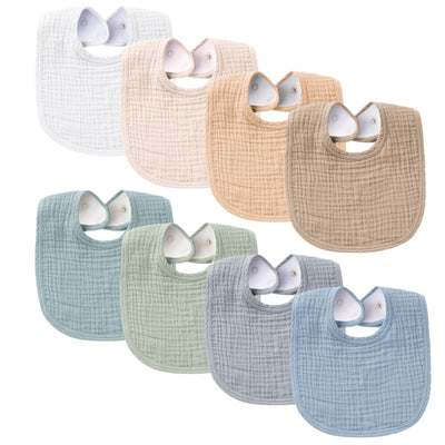 Set of eight baby bibs in various colors on a white background