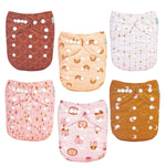 Set of six patterned cloth diapers on a white background