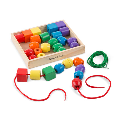 Colorful wooden bead set with a box and separate beads on a white background